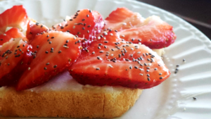 Plate of Toast with Ricotta Cheese, Sliced Strawberry's and Chia Seeds (c) Laura's Freelance Photograph